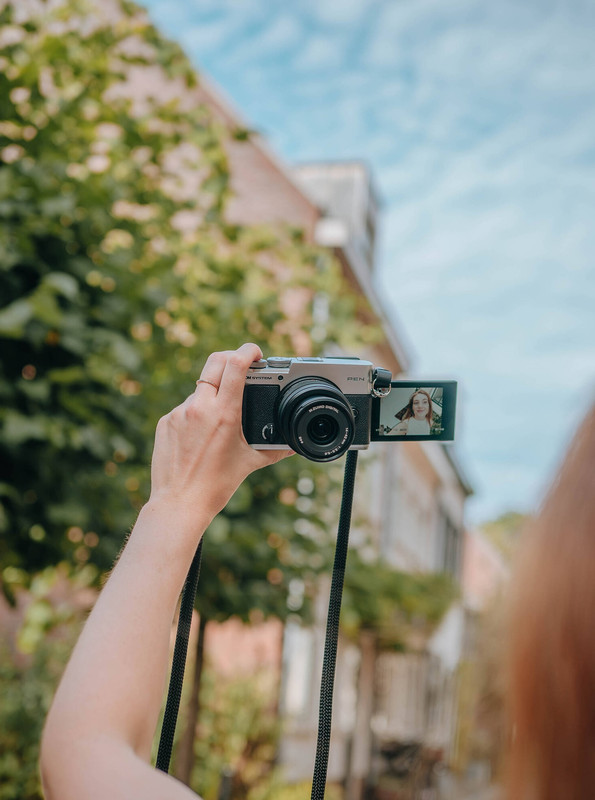 OM SYSTEM PEN Mirrorless Camera lifestyle shot