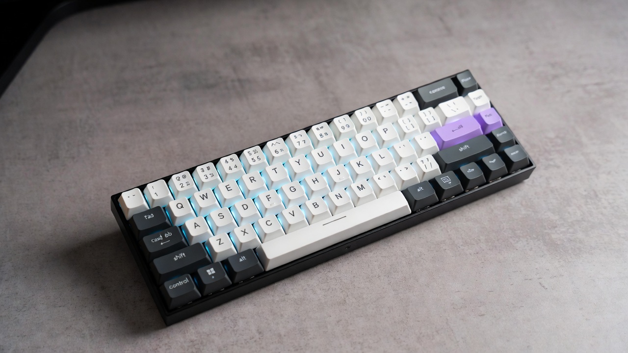 Ducky One 3 Mini 60% mechanical keyboard compact layout on clean desk setup