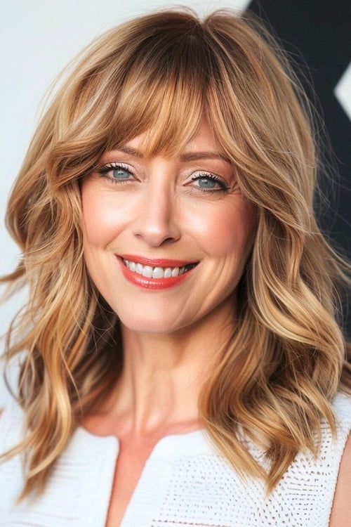 Medium haircut including feathered layers.