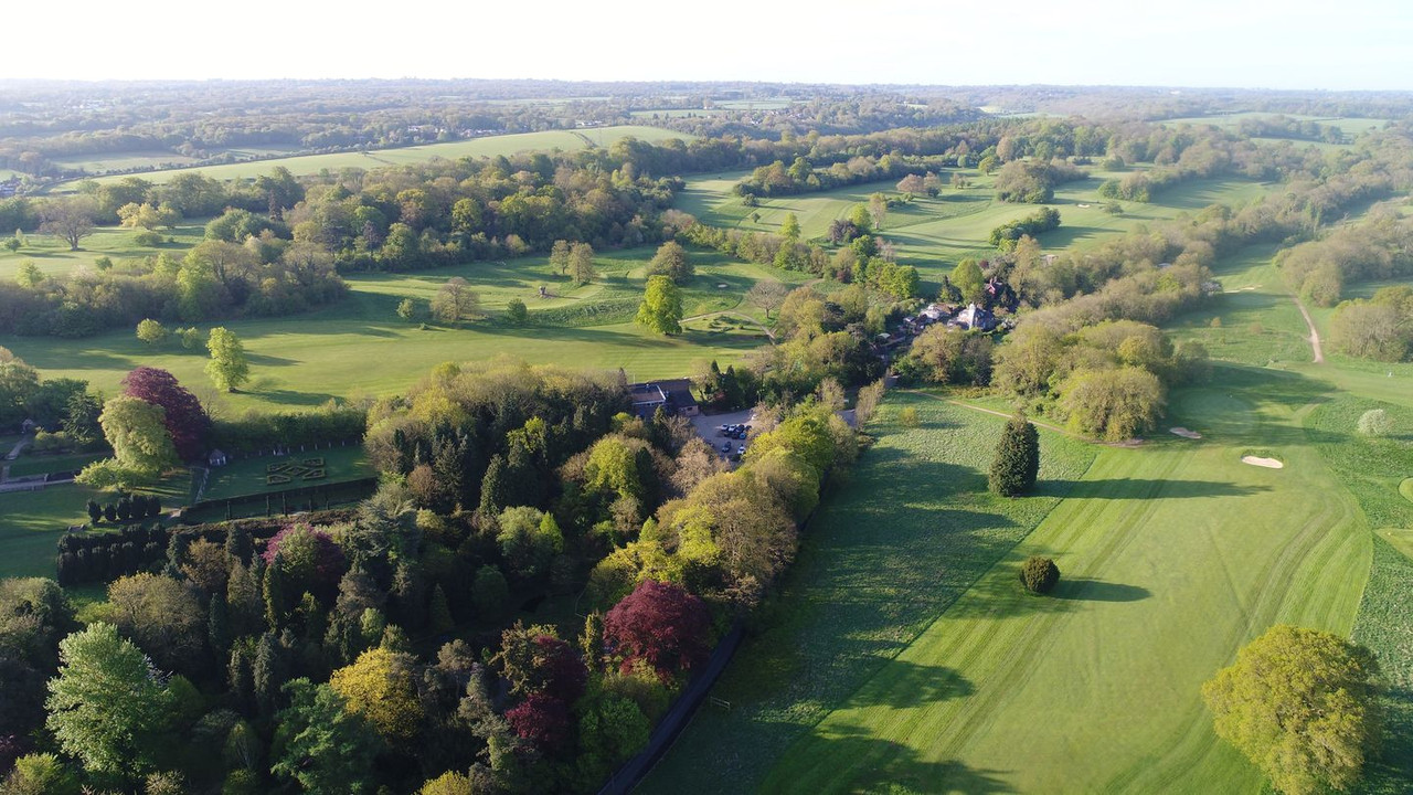 Mature trees framing a fairway at High Elms Golf Course