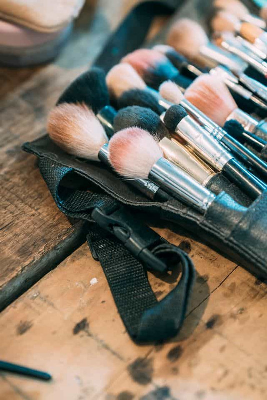 Makeup brushes with product buildup between bristles 