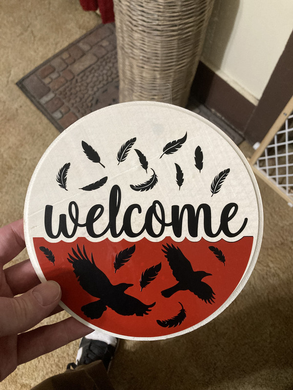 handcrafted raven welcome sign