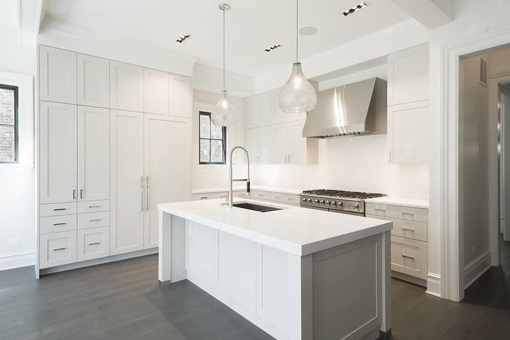 clear-seeded-glass-pendants-wide-kitchen-island-sink.jpg