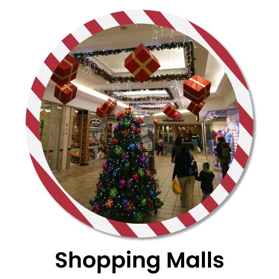 Christmas magic in a shopping mall with a lavishly decorated Xmas tree adorned with ornaments and hanging gift boxes from the ceiling