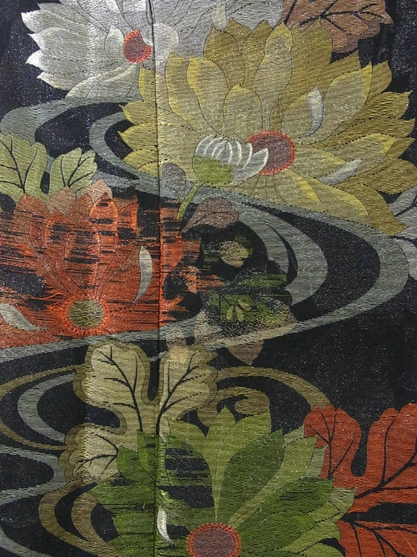 Close-up of floral embroidery on antique kimono