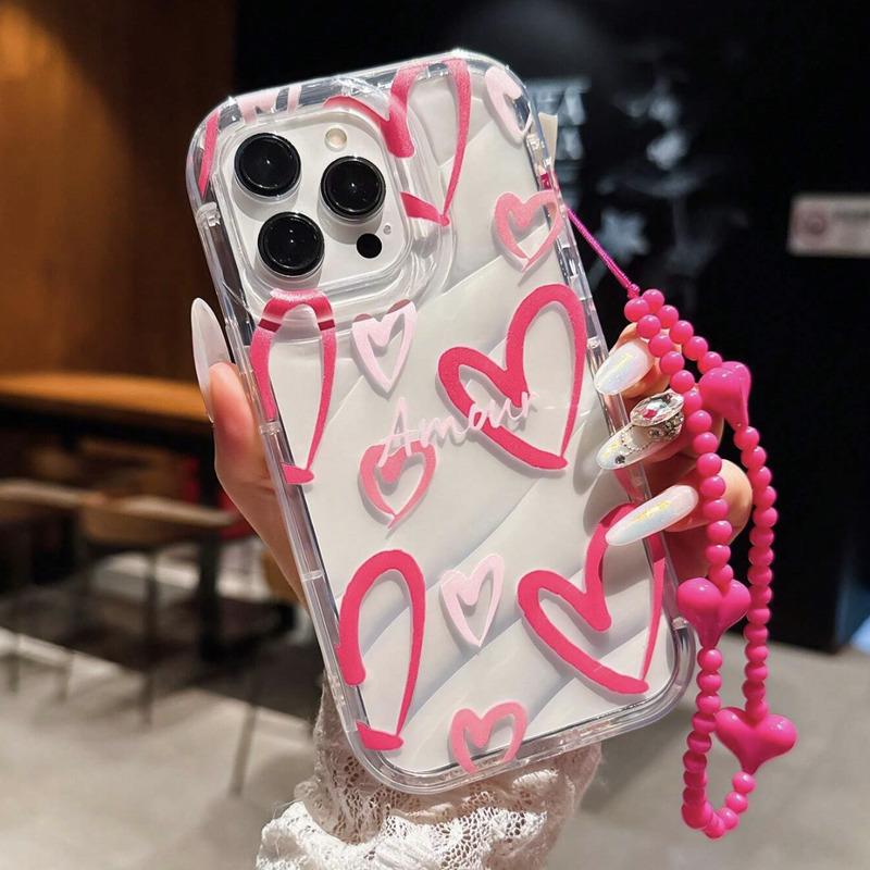 Foto de Funda transparente con diseño corazón. Incluye correa de mano.