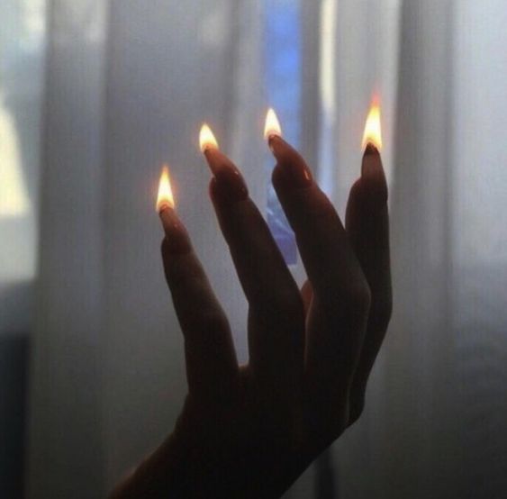 candles on her fingernails