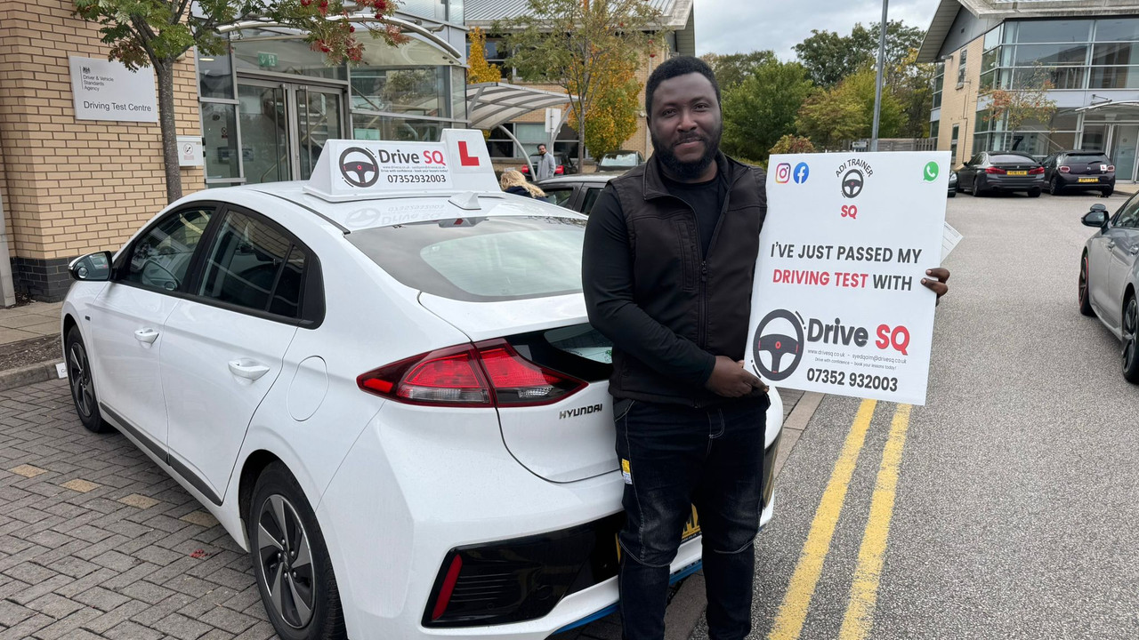 Happy new driver with pass certificate in Manchester