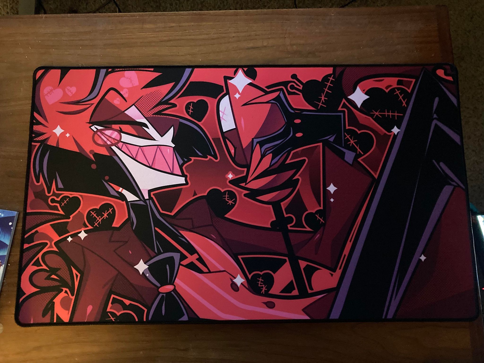 a desk mat featuring alastor the radio demon from hazbin hotel
