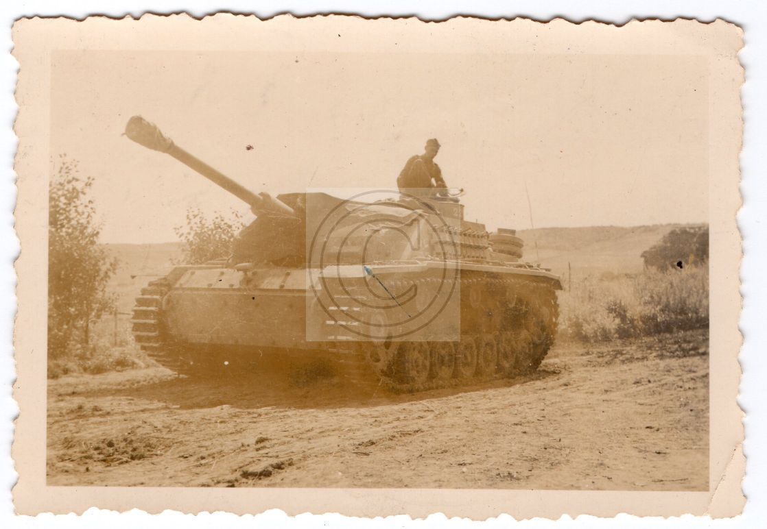 German Sturmgeschütz Panzermen Posed on his Tank
