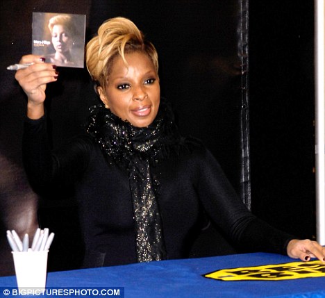 Mary J. Blige smoking a cigarette (or weed)
