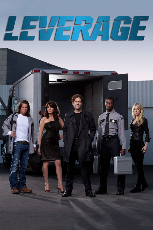 five people stand in front of a van and some warehouses looking ready to cut a bitch.