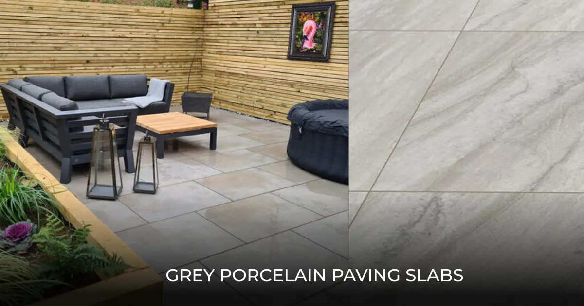 Grey porcelain paving slabs installed in a garden patio sitting area featuring an L-shaped sofa and a hot tub. These textured grey tiles provide a modern, clean finish for garden terraces and courtyards.