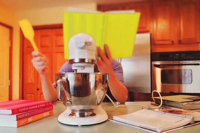 stressful dinner prep with cookbook