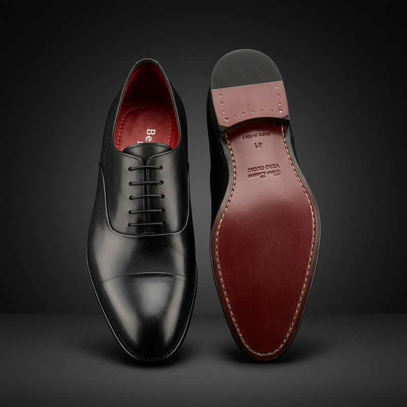 Premium black leather monk strap shoes on white background