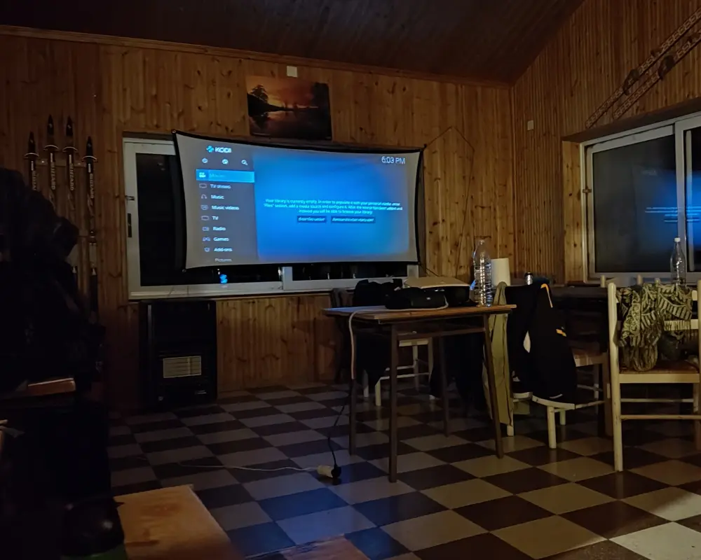 The projector screen being set up for movie night