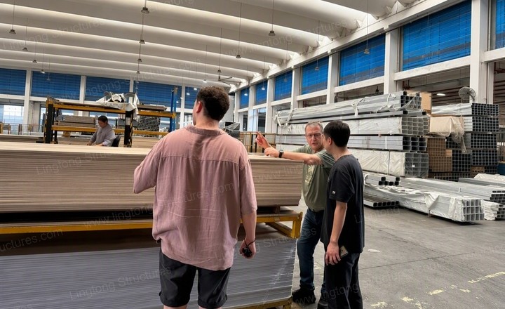Lingtong Tent team explaining frame assembly to client