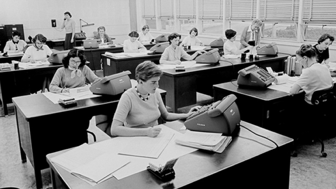 Women working with early computing equipment