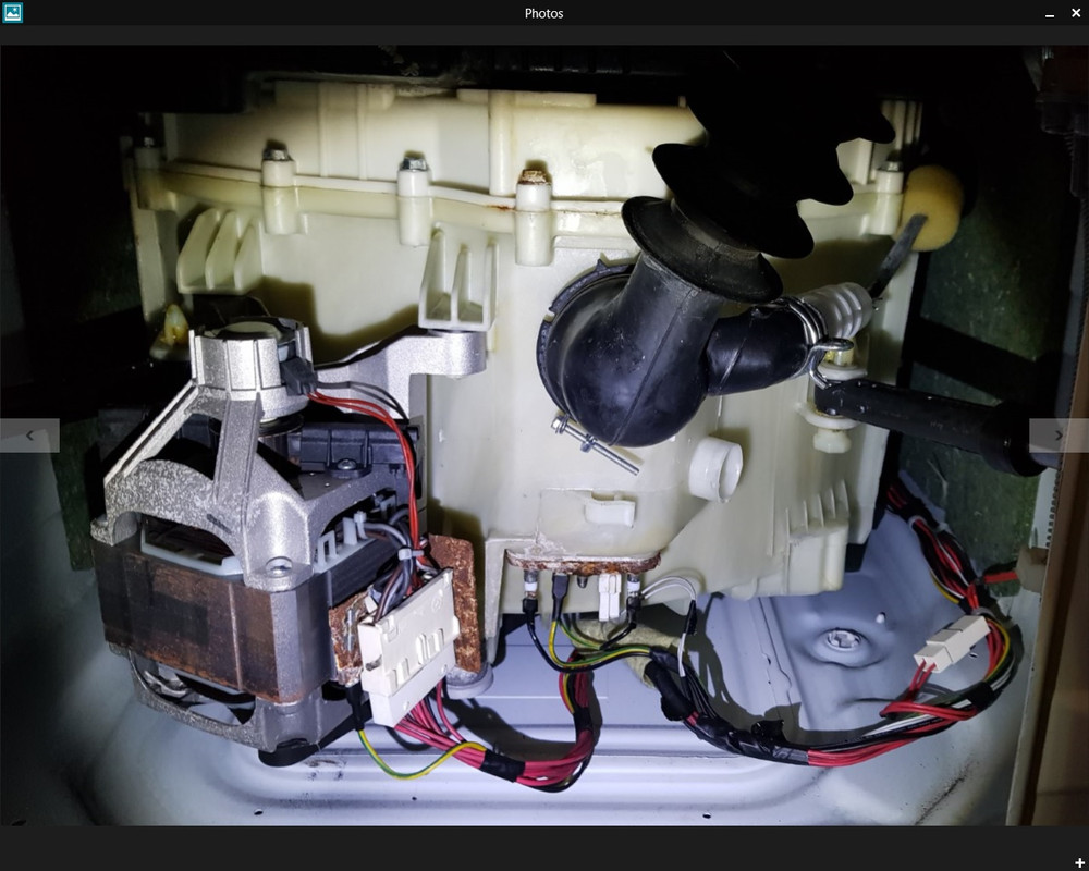 Underneath Haier washing machine