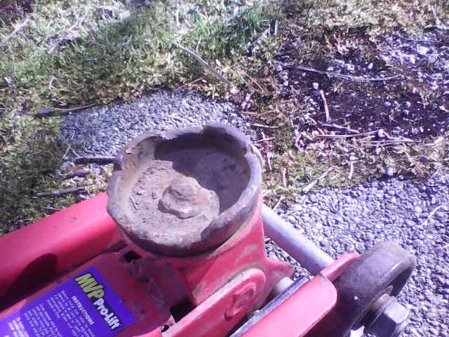 Hockey Puck and Floor Jack: Thanks to your suggestions, I got my floor jack  adaptor made. These hockey pucks will provide a firm, non-damaging grip on  the pinch weld when lifting my