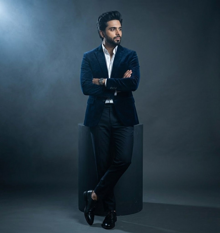 AI-generated example result for the creative-images prompt: Blue Velvet Blazer Moody Studio Spotlight Portrait by Prompt Craft