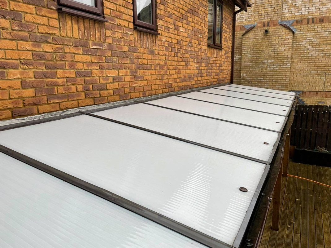 A clean conservatory with a sparkling glass roof