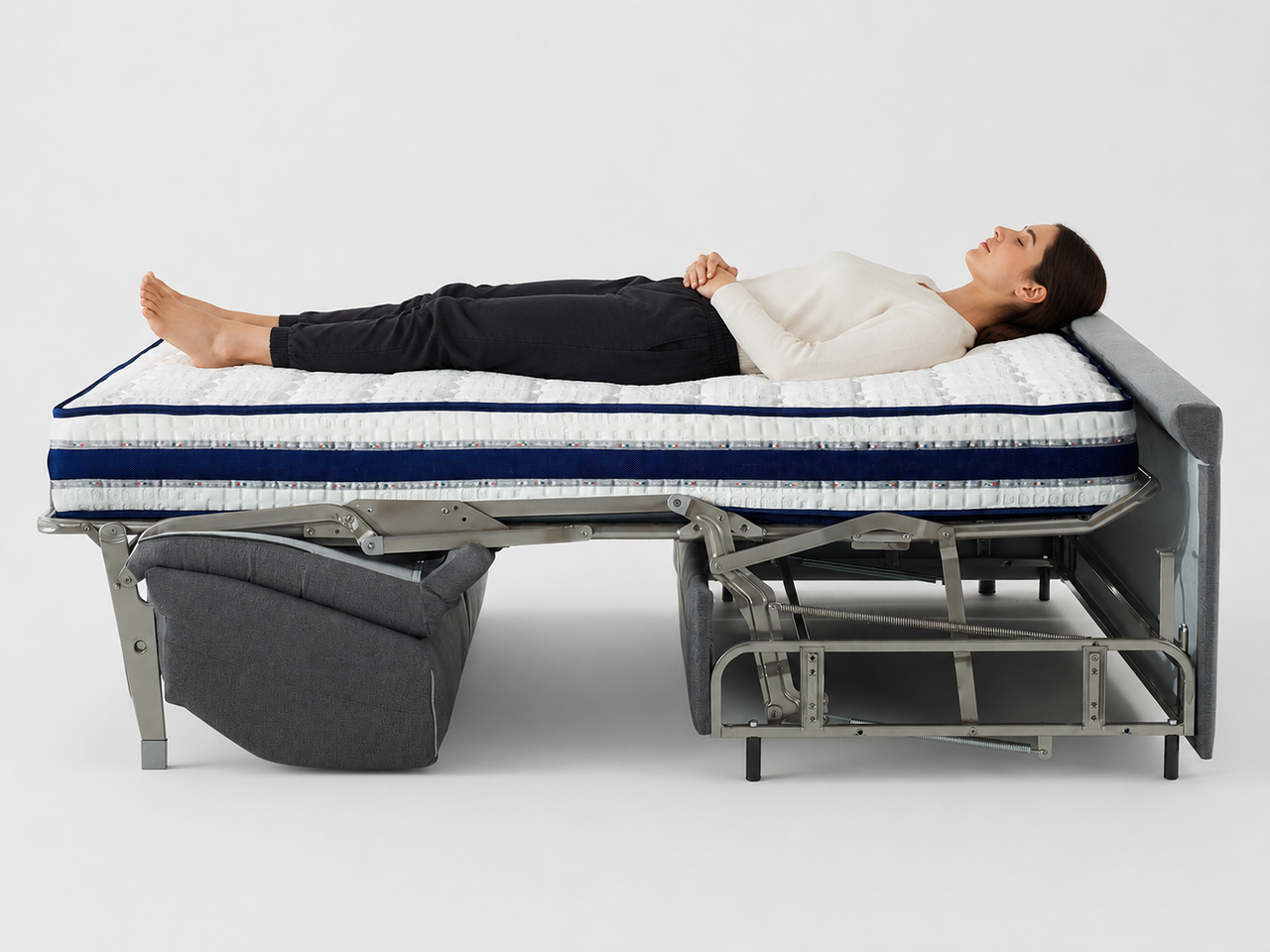 Canapé convertible Reverso ouvert en lit avec une personne allongée - couchage 195 cm