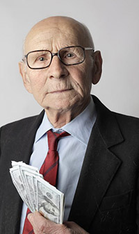 Old rich man holding cash