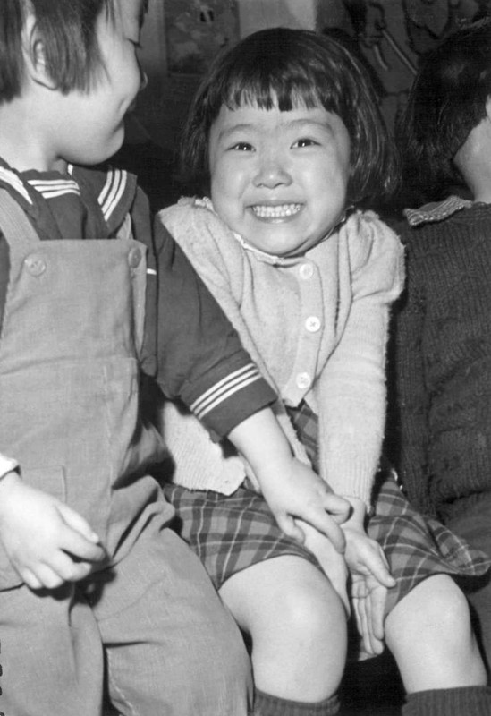 1943-by-Tom-Parker-little-girl-is-tickled-at-posing-for-her-picture-in-a-nursery-school-at-the-Hea