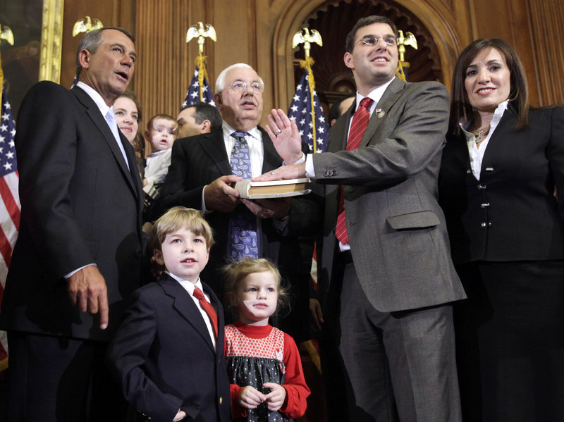 Justin Amash was sworn in as US Representative with his family and the Speaker of the House of Representatives, John Boehner on Jan. 5, 2011