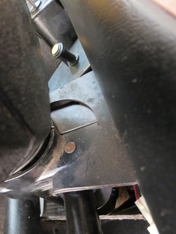 Steering column clamp showing nail replacing roll pin