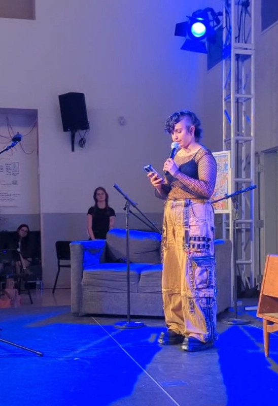 Photo of me reading on stage