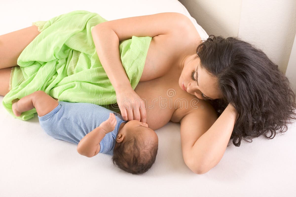 ethnic hispanic mother breastfeeding her son 16028311