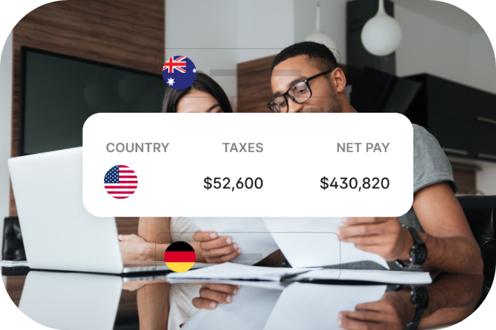Two coworkers chatting in a conference room while seated