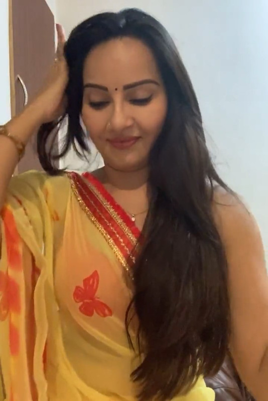 Geetanjali Mishra Sexy Cleavage and armpit though in Orange sleevless saree.mp4_snapshot_01.10.966