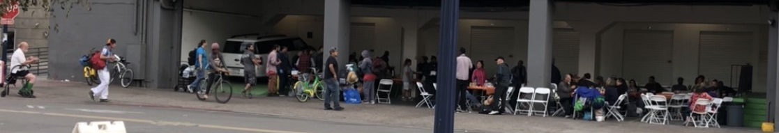 Diners and volunteers mingle at Ballpark Self Storage in the Gaslamp District in San Diego, California.