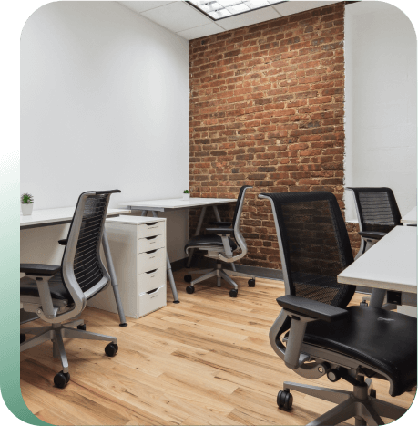 Team office and suite with multiple desks around.