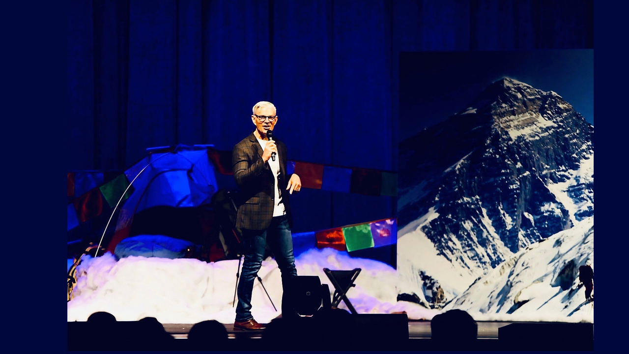 Dr. Joe Hill delivering a keynote on stage
