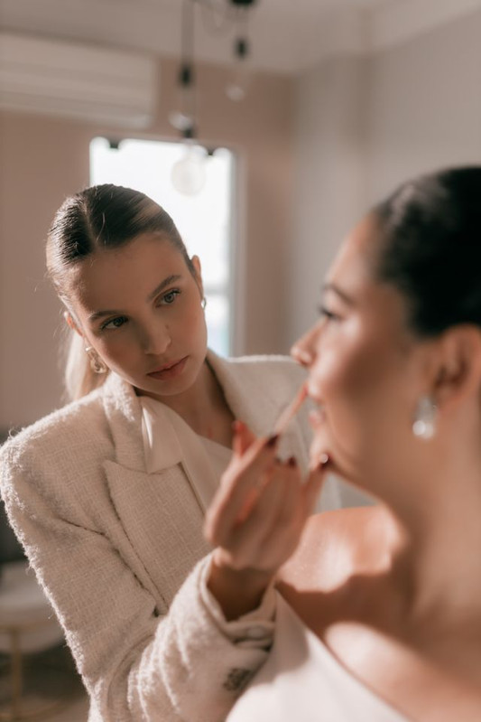 professional makeup artist doing makeup of a model 