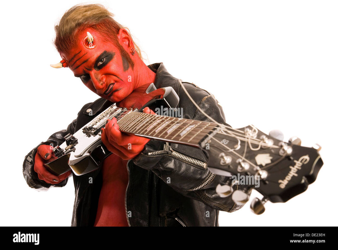 red-devil-pointing-an-electric-guitar-at-the-viewer-DE23EH