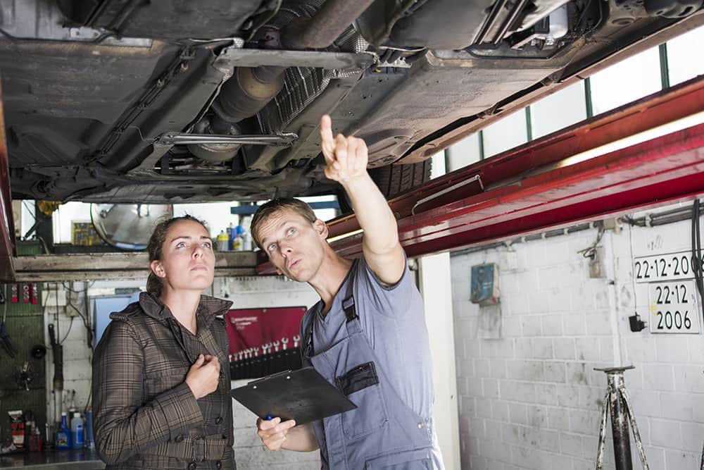 carter-fuel-systems-resources-mechanic-pointing-with-woman-min.jpg