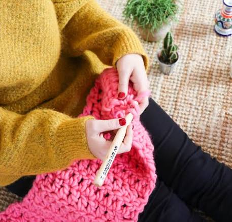 Beginner crochet Granny Square pattern with yarn and crochet hook