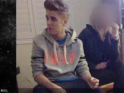 Justin Bieber smoking a cigarette (or weed)
