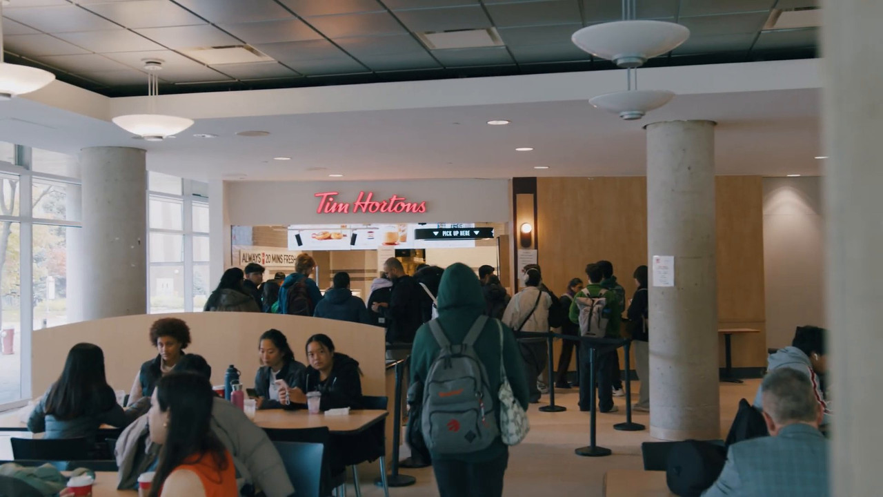 Finished Tim Hortons counter and seating area open and serving customers