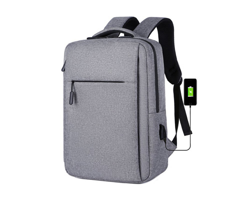 2026 hot-selling custom slim business laptop backpack with USB charging port placed on luggage case, featured as best B2B corporate gift choice