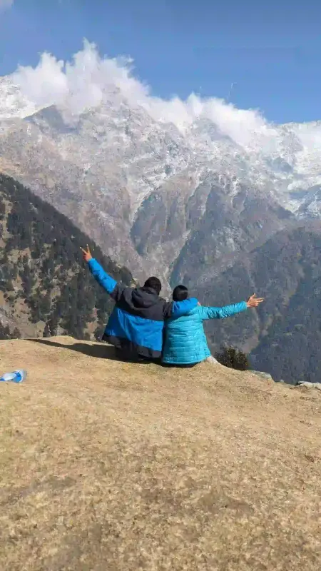 Couple Sitting at Mountain Bonding Trip