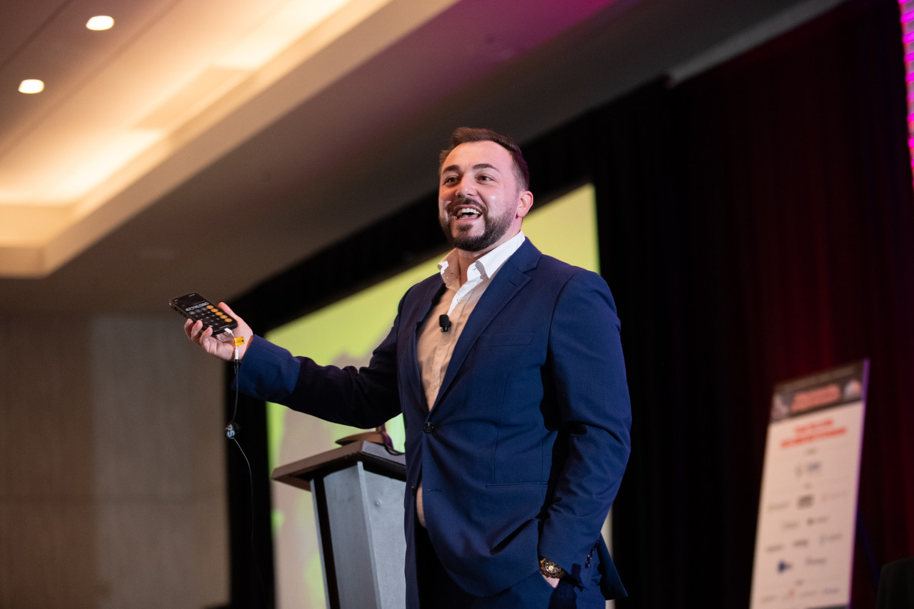 Chris Michael delivering a behavioral intelligence keynote at an international executive conference