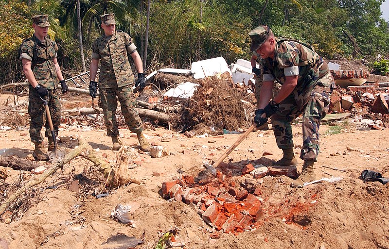 US-Navy-050115-M-2725-N-002-Marine-Corps-Sgt-Charles-Burnette-breaks-apart-a-chunk-of-brick-wall-stu.jpg