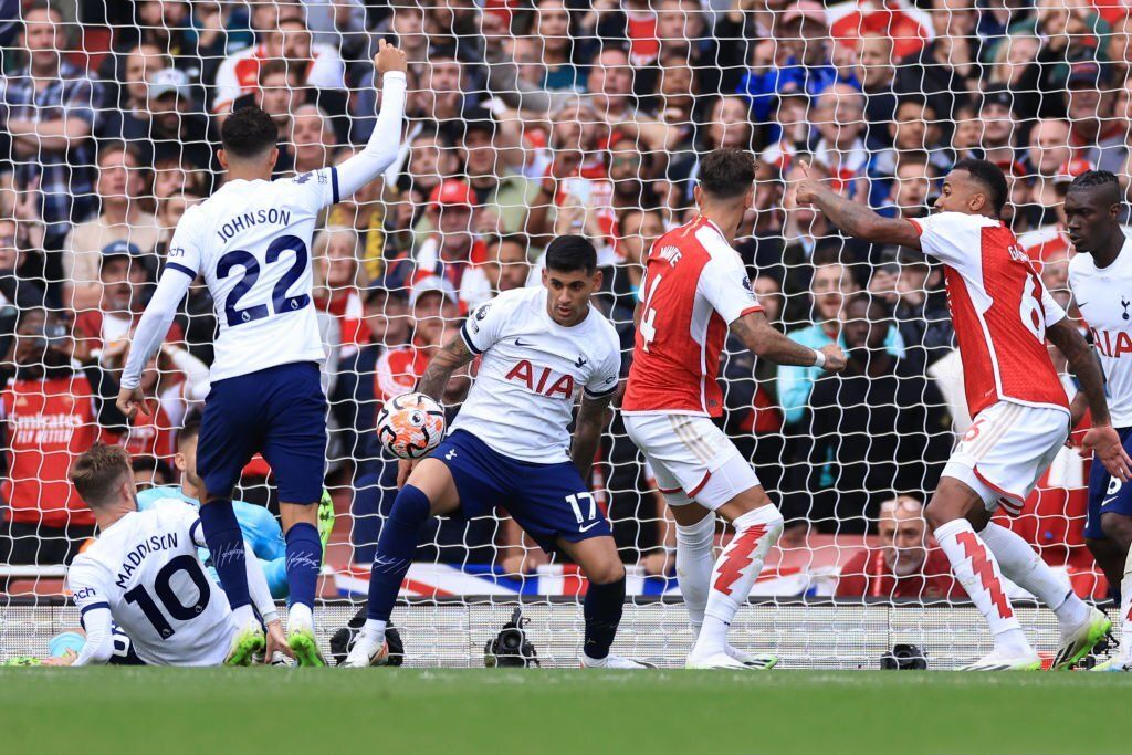 Cristian Romero of Tottenham Hotspur handles the ball resulting in a penalty