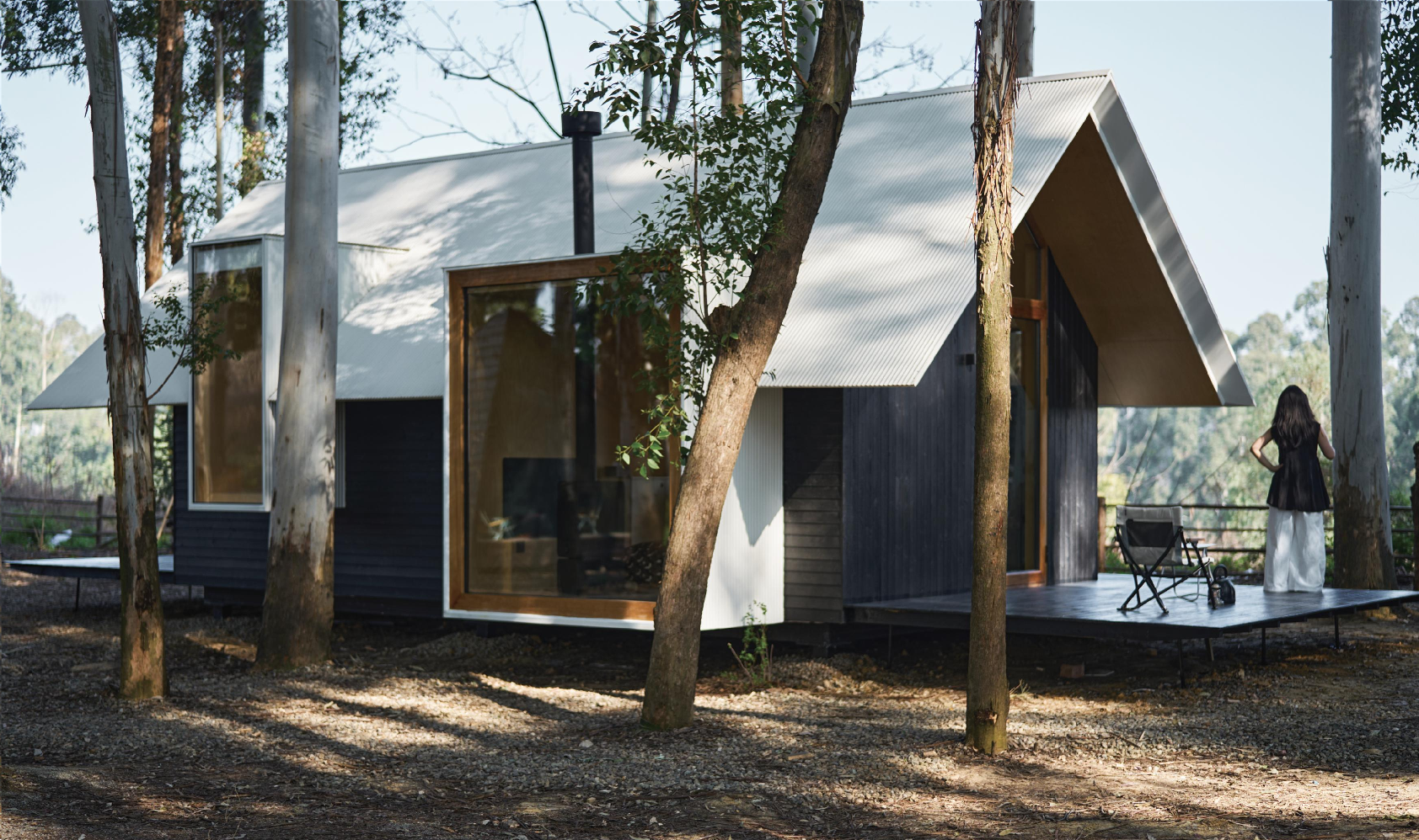 Prefab mobile wood house with exterior wood paneling